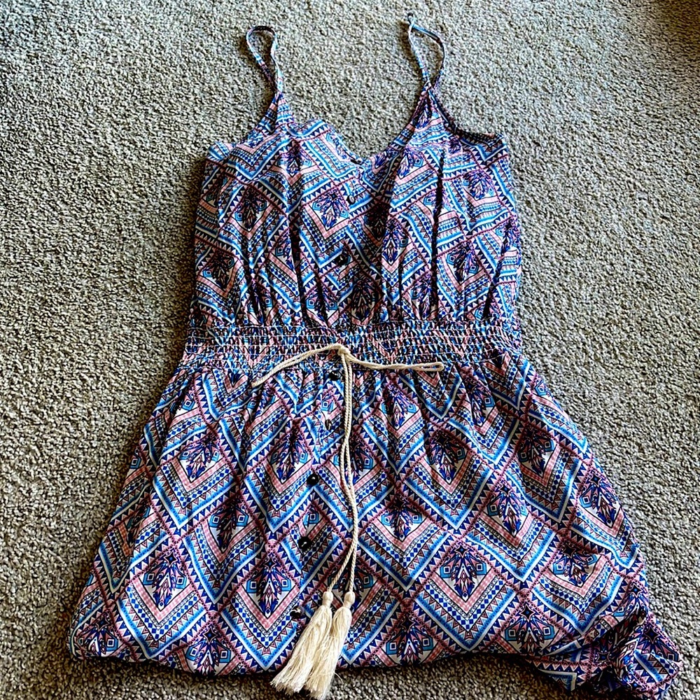 Maxi length, spaghetti strap patterned dress.